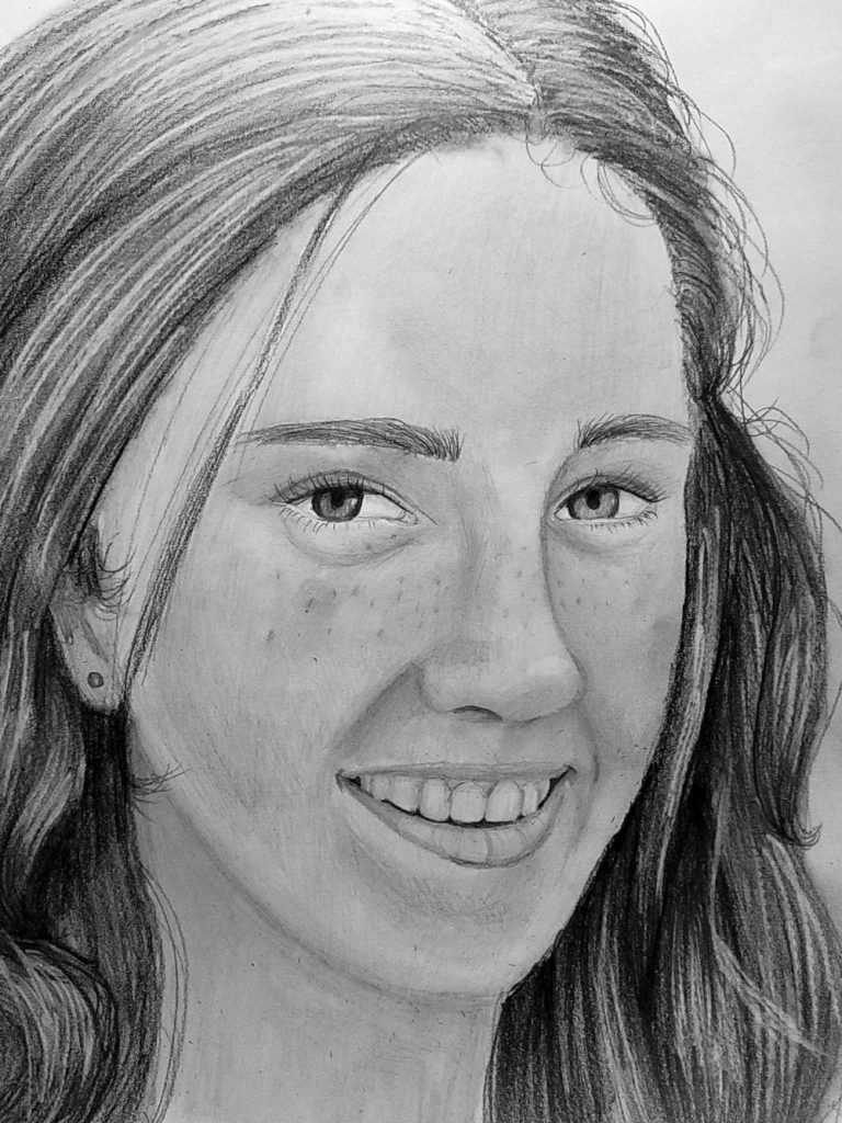 A graphite pencil drawing of a lady's smiling face.