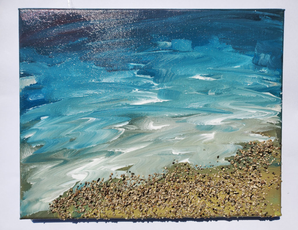 Painting of a blue and white wave rushing over the beach sand. The sand is made of real sand and sapphires.