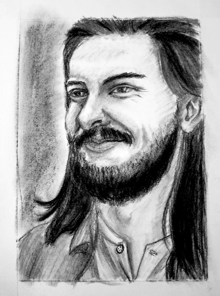 A charcoal drawing of a male with long hair smirking.